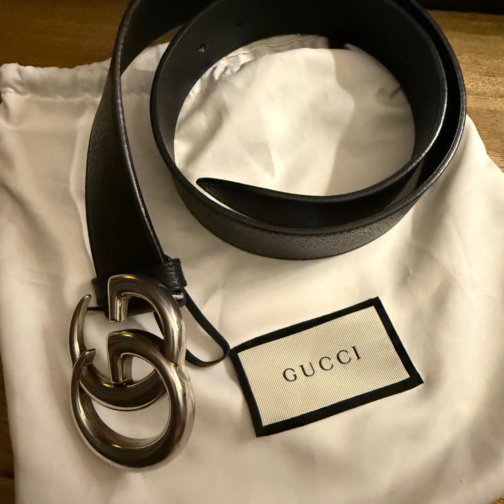 Black Gucci belt with silver buckle